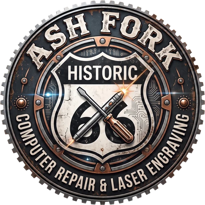Ash Fork Computer Repair and Laser Engraving logo: a Historic Route 66 shield with a crossed screwdriver and laser engraver inside a copper gear